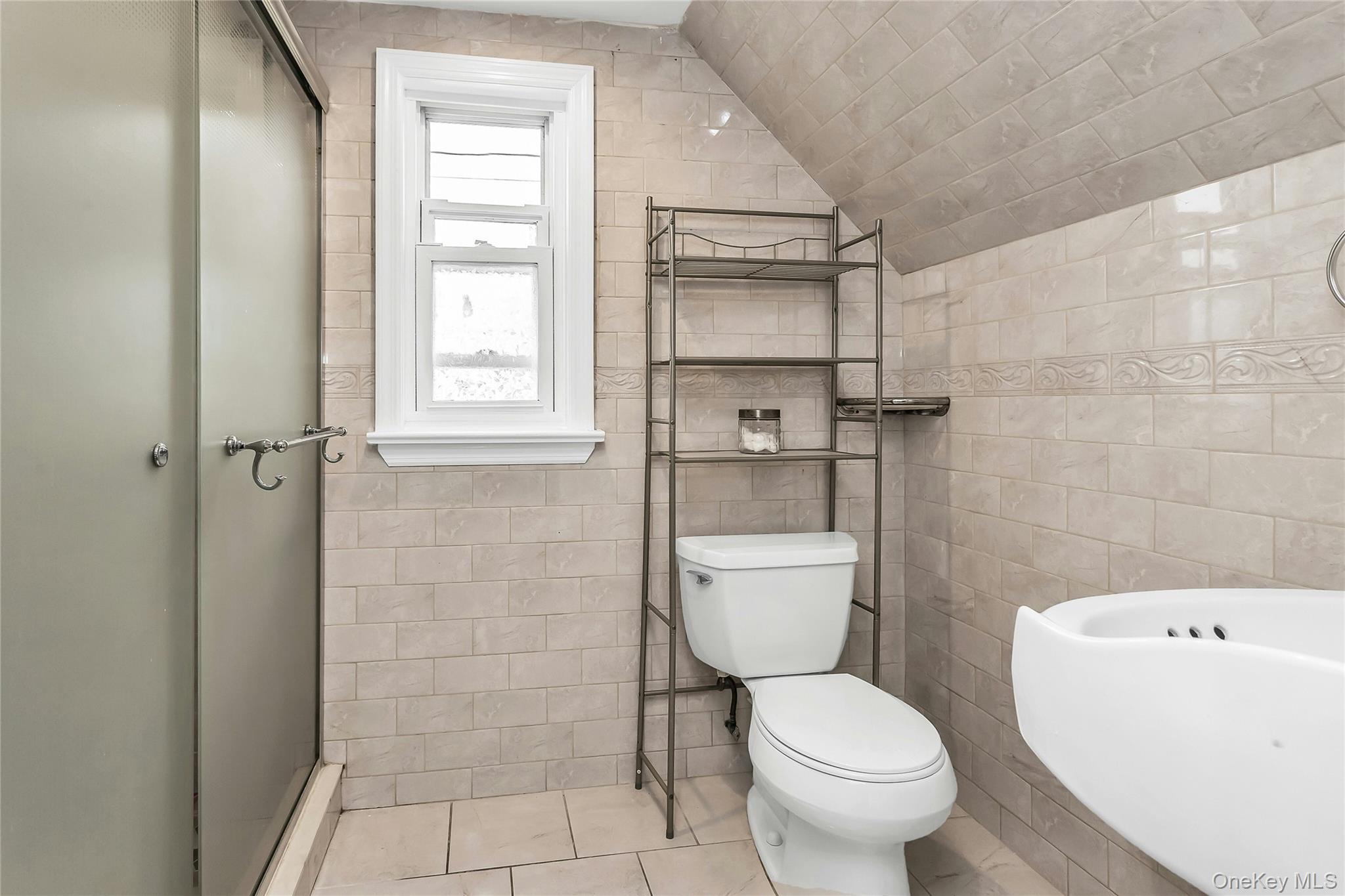 103 Union Street Valley Stream, NY 11580 - Photo 9 of 19 a bathroom with a toilet and a shower
