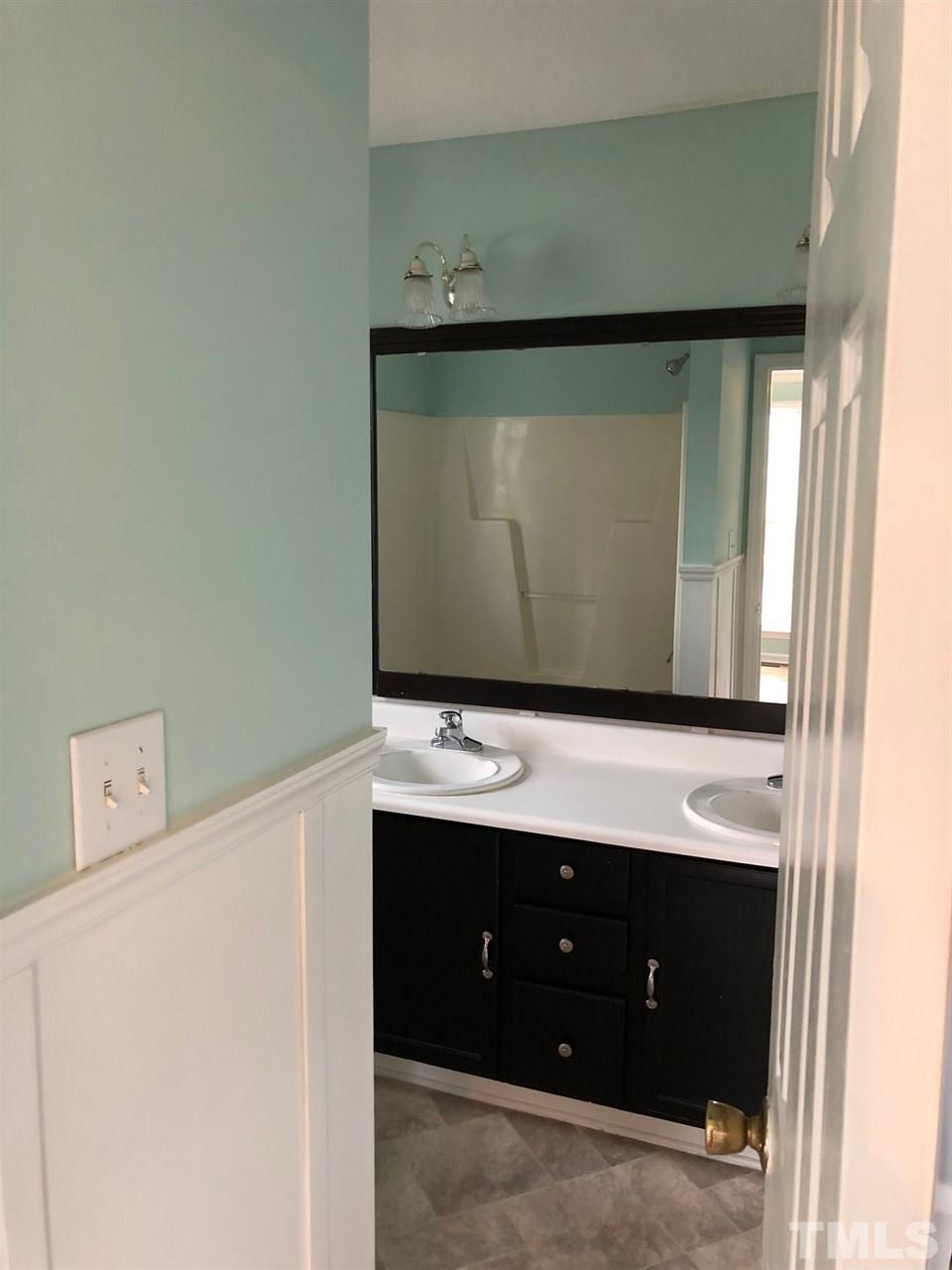 2108 Ruddy Road Raleigh, NC 27616 - Photo 8 of 19 a bathroom with a sink and a mirror