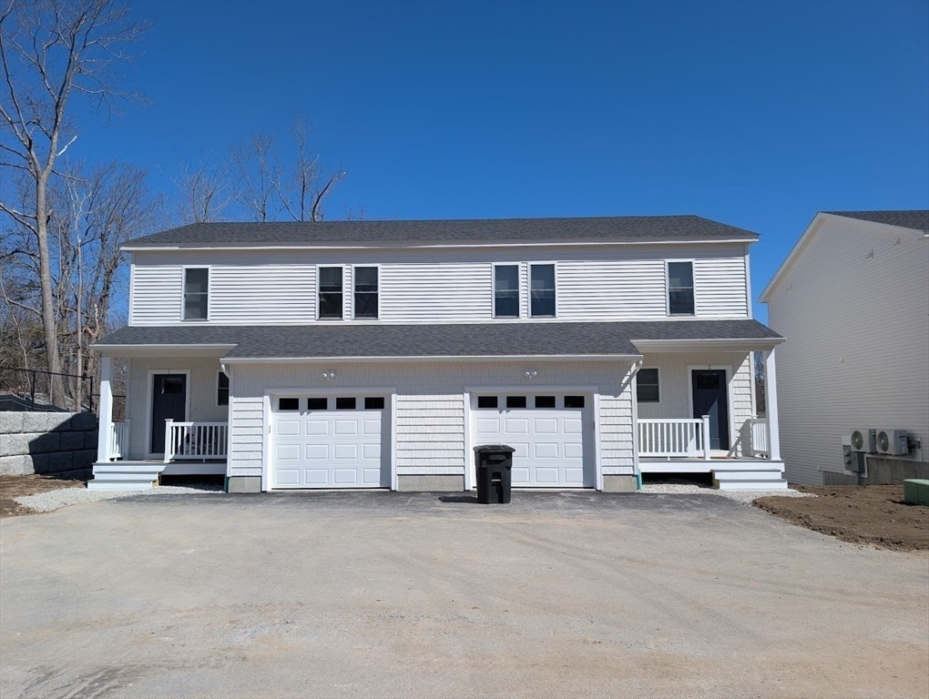 a front view of a house with a garage
