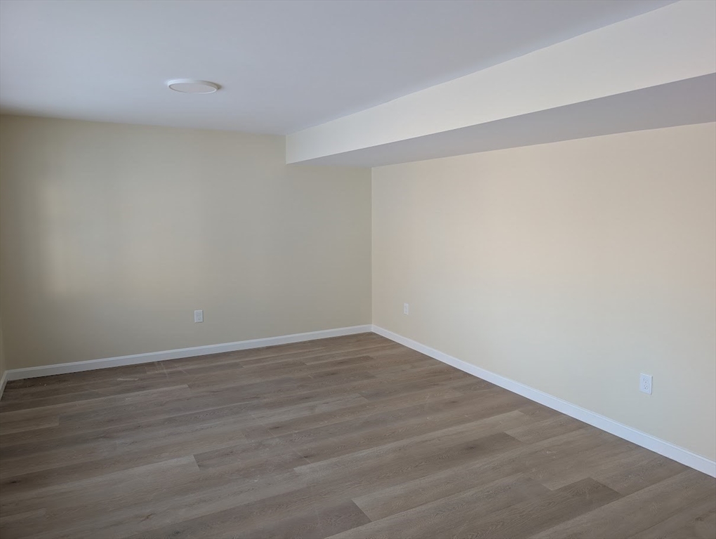 778 Main Street, Unit 6 Leicester, MA 01524 - Photo 15 of 39 a view of an empty room with wooden floor