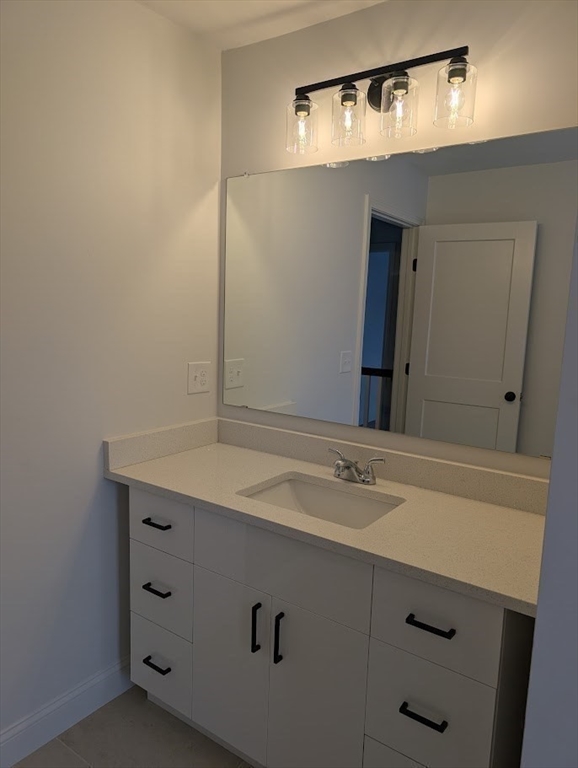 778 Main Street, Unit 6 Leicester, MA 01524 - Photo 20 of 39 a bathroom with a sink and a mirror