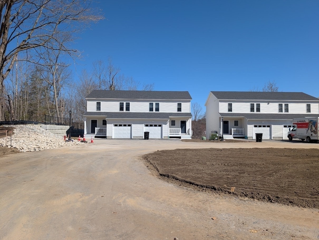 778 Main Street, Unit 6 Leicester, MA 01524 - Photo 2 of 39 a view of a big building with big yard and large trees