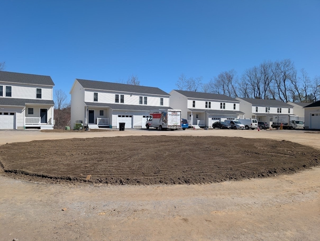 778 Main Street, Unit 6 Leicester, MA 01524 - Photo 3 of 39 a front view of a house with a yard