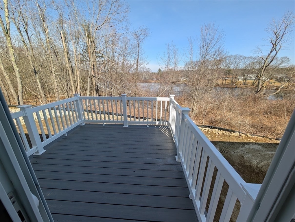 778 Main Street, Unit 6 Leicester, MA 01524 - Photo 33 of 39 a view of balcony with wooden floor and fence