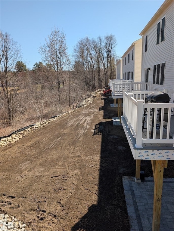 778 Main Street, Unit 6 Leicester, MA 01524 - Photo 38 of 39 a view of a house with backyard and trees