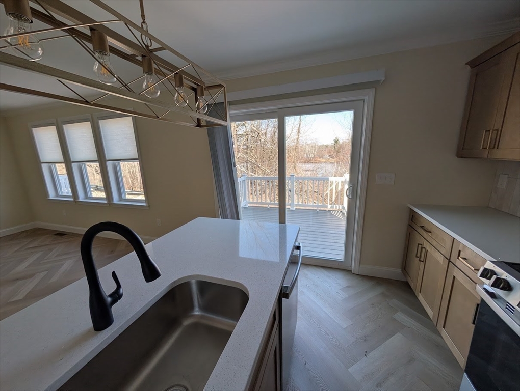 778 Main Street, Unit 6 Leicester, MA 01524 - Photo 5 of 39 a view of a sink and a stove in a kitchen