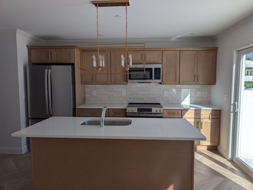 778 Main Street, Unit 6 Leicester, MA 01524 - Photo 10 of 39 a kitchen with stainless steel appliances a sink a stove a microwave a refrigerator a sink and cabinets