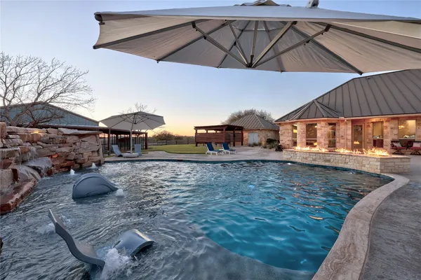 a view of a swimming pool with a patio