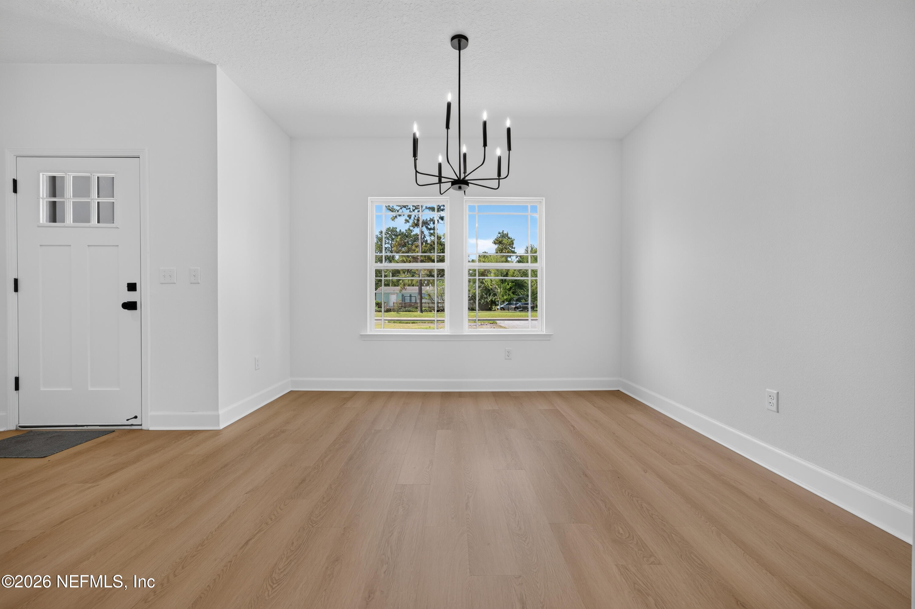 4362 Angora Street Middleburg, FL 32068 - Photo 25 of 31 wooden floor in an empty room with a window