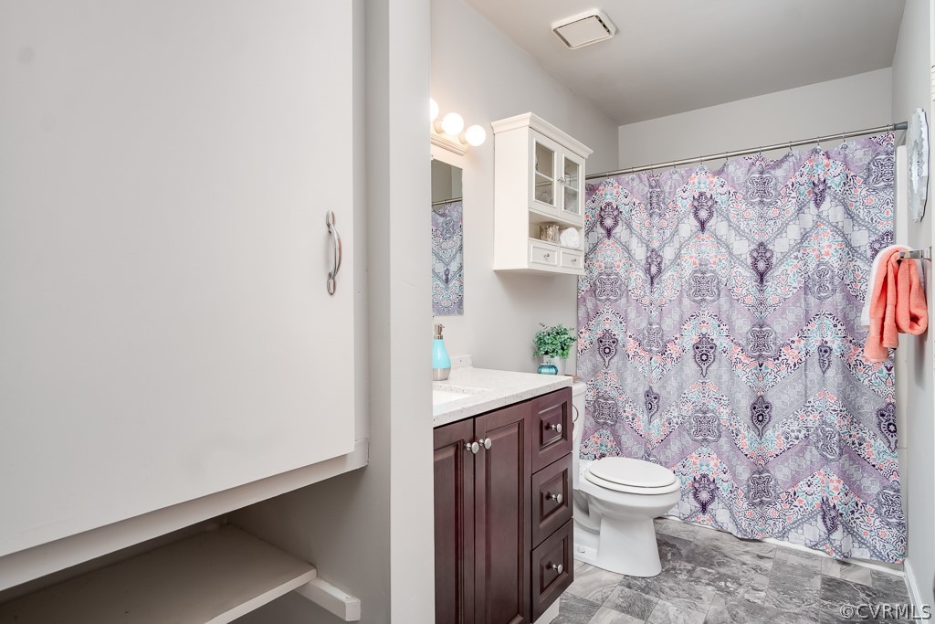 4705 Twelveoaks Road Midlothian, VA 23112 - Photo 13 of 25 a bathroom with a toilet a sink and a shower