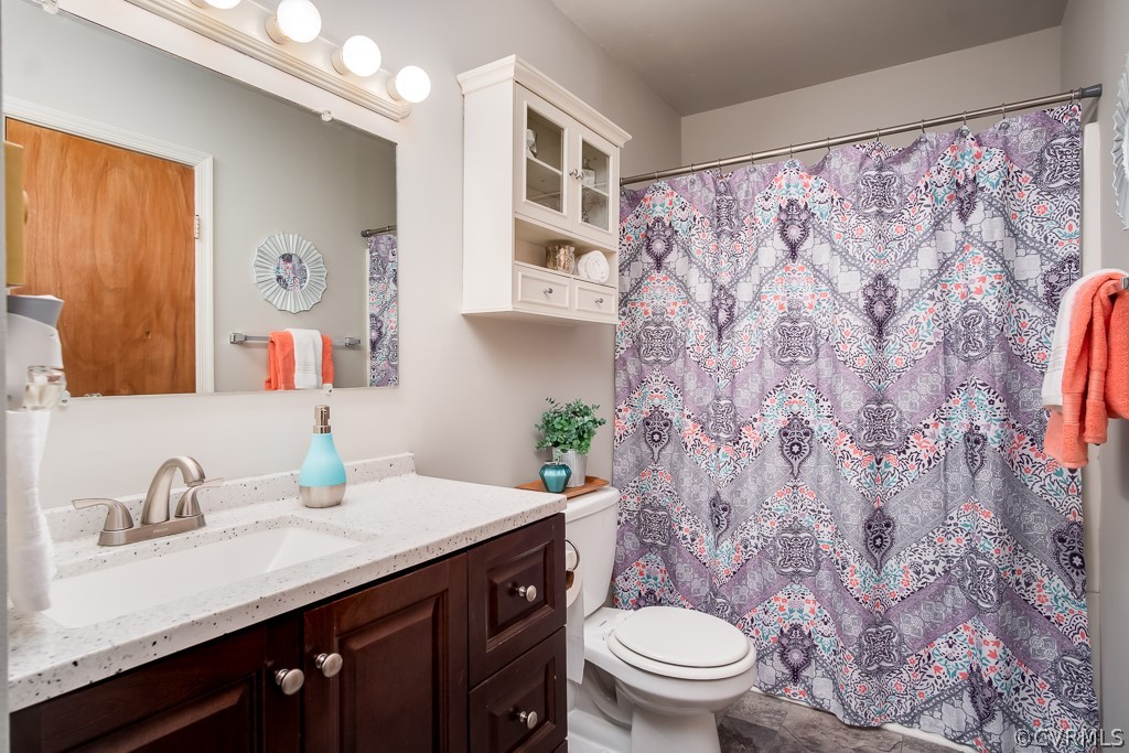 4705 Twelveoaks Road Midlothian, VA 23112 - Photo 14 of 25 a bathroom with a granite countertop sink and a toilet