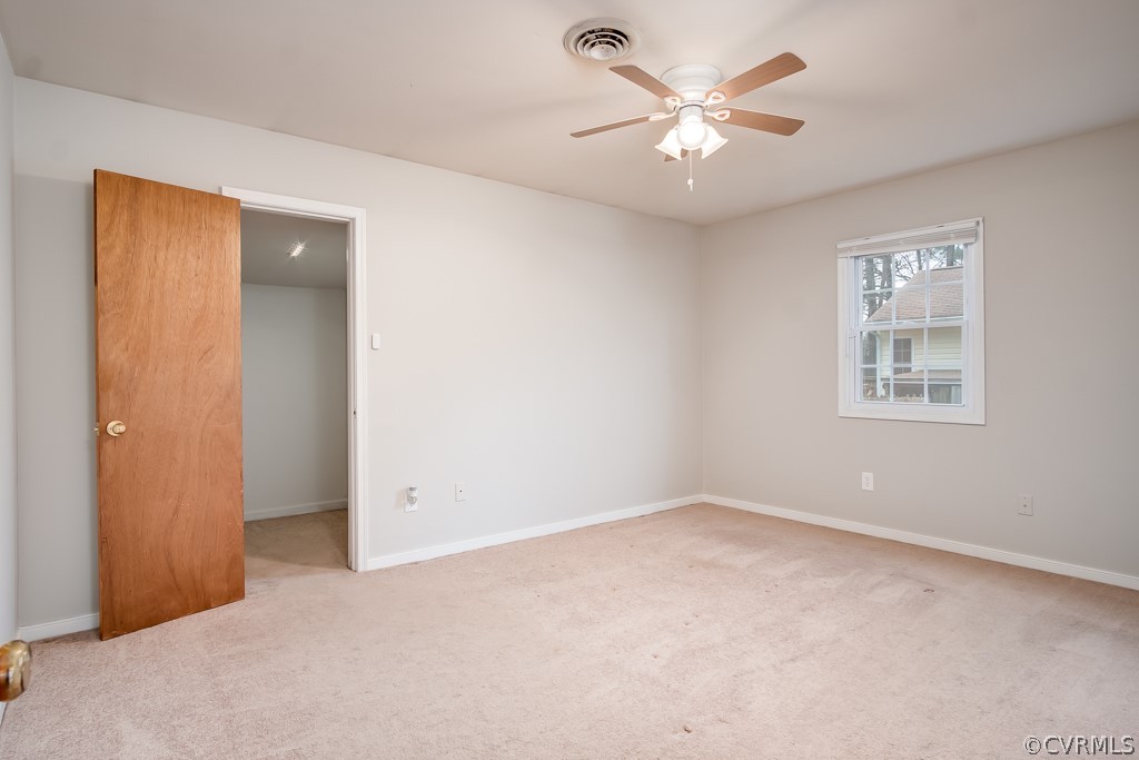 4705 Twelveoaks Road Midlothian, VA 23112 - Photo 16 of 25 an empty room with a ceiling fan and a window