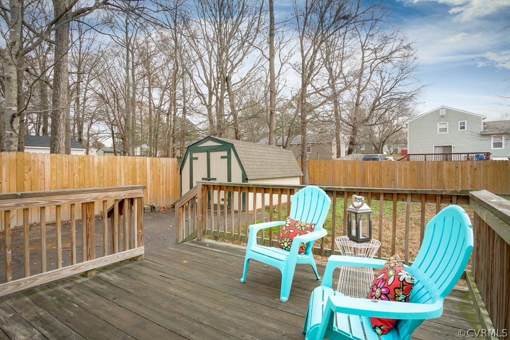 4705 Twelveoaks Road Midlothian, VA 23112 - Photo 24 of 25 a view of a chair and table on the wooden floor