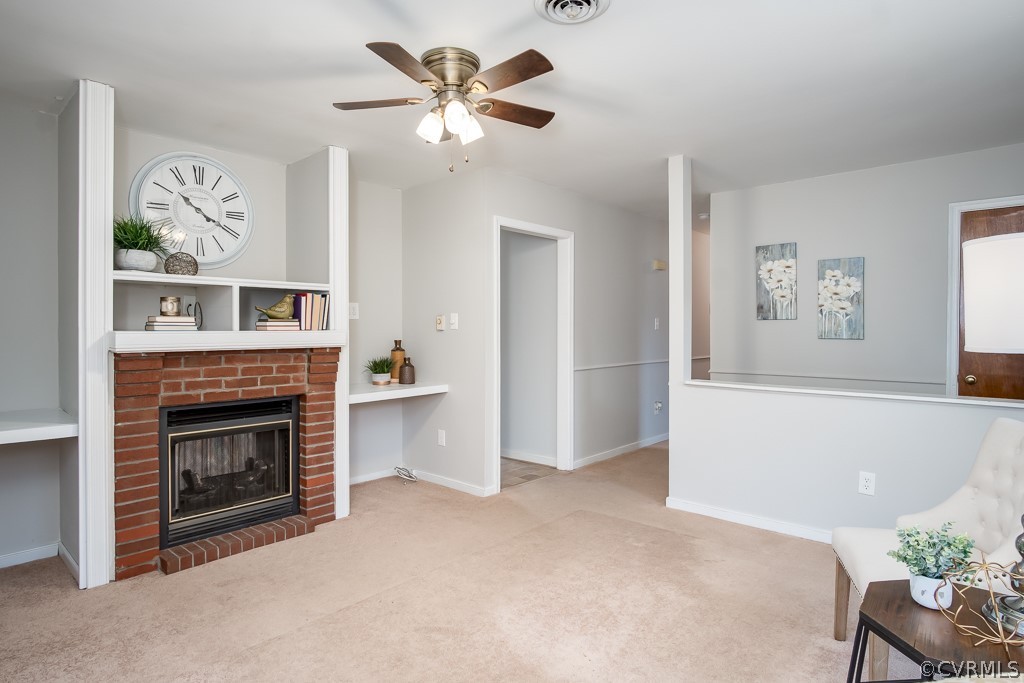 4705 Twelveoaks Road Midlothian, VA 23112 - Photo 7 of 25 a view of a livingroom with a fireplace a chandelier and windows
