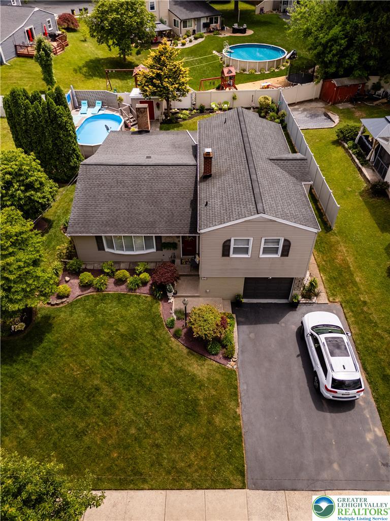 2087 Hopewell Road Bethlehem, PA 18017 - Photo 5 of 38 An aerial perspective reveals a charming residence with a pristine lawn and private pools.