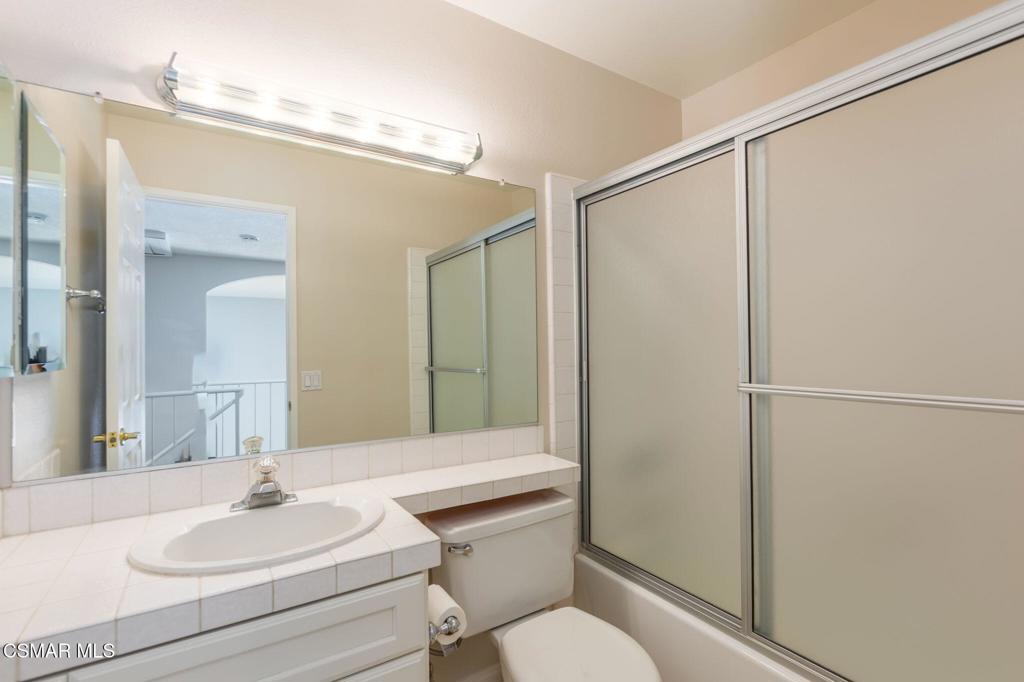 1047 Windmill Lane Oak Park, CA 91377 - Photo 10 of 13 a bathroom with a sink toilet and shower