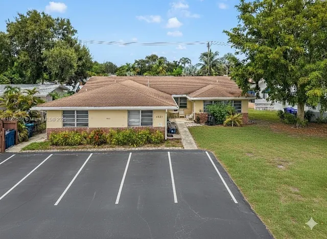 a aerial view of a house with a yard