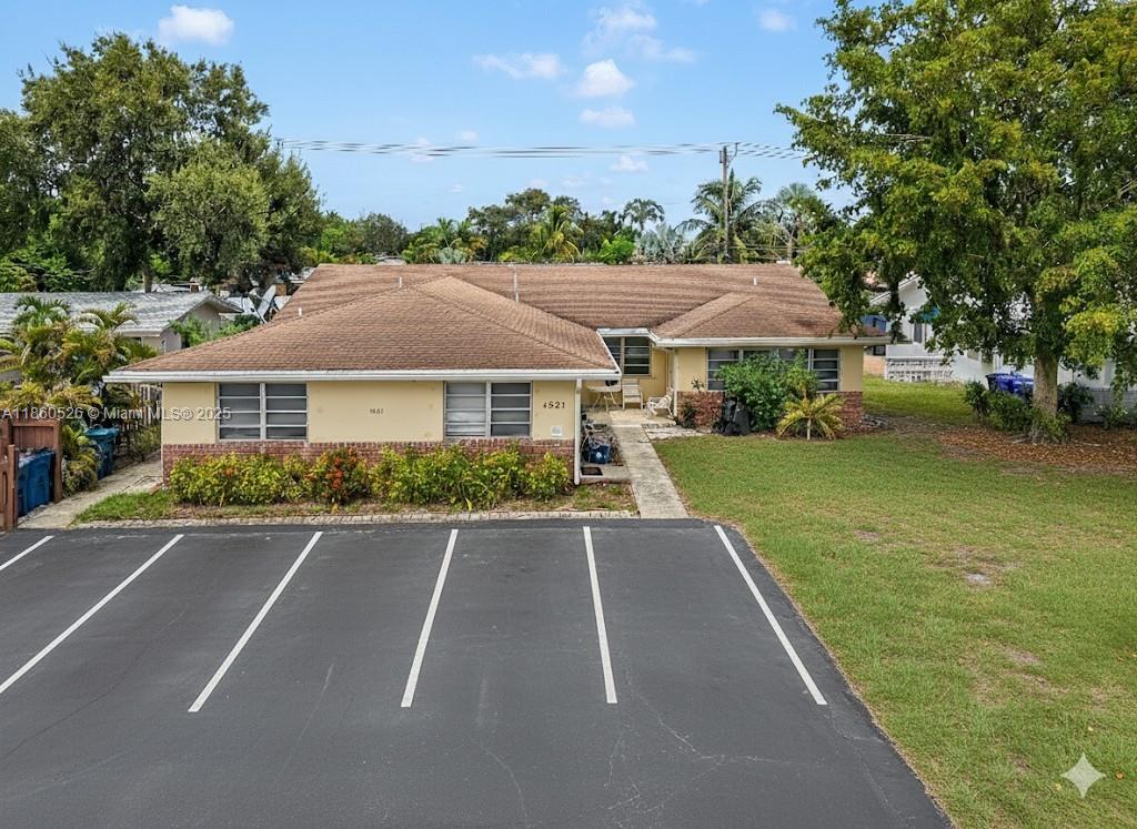 1821 Northeast 56th Street, Unit 4 Fort Lauderdale, FL 33308 - Photo 1 of 9 a aerial view of a house with a yard