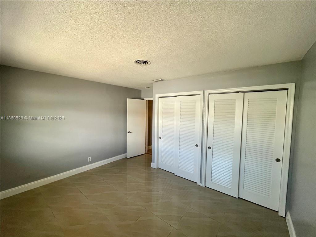 1821 Northeast 56th Street, Unit 4 Fort Lauderdale, FL 33308 - Photo 5 of 9 a view of an empty room