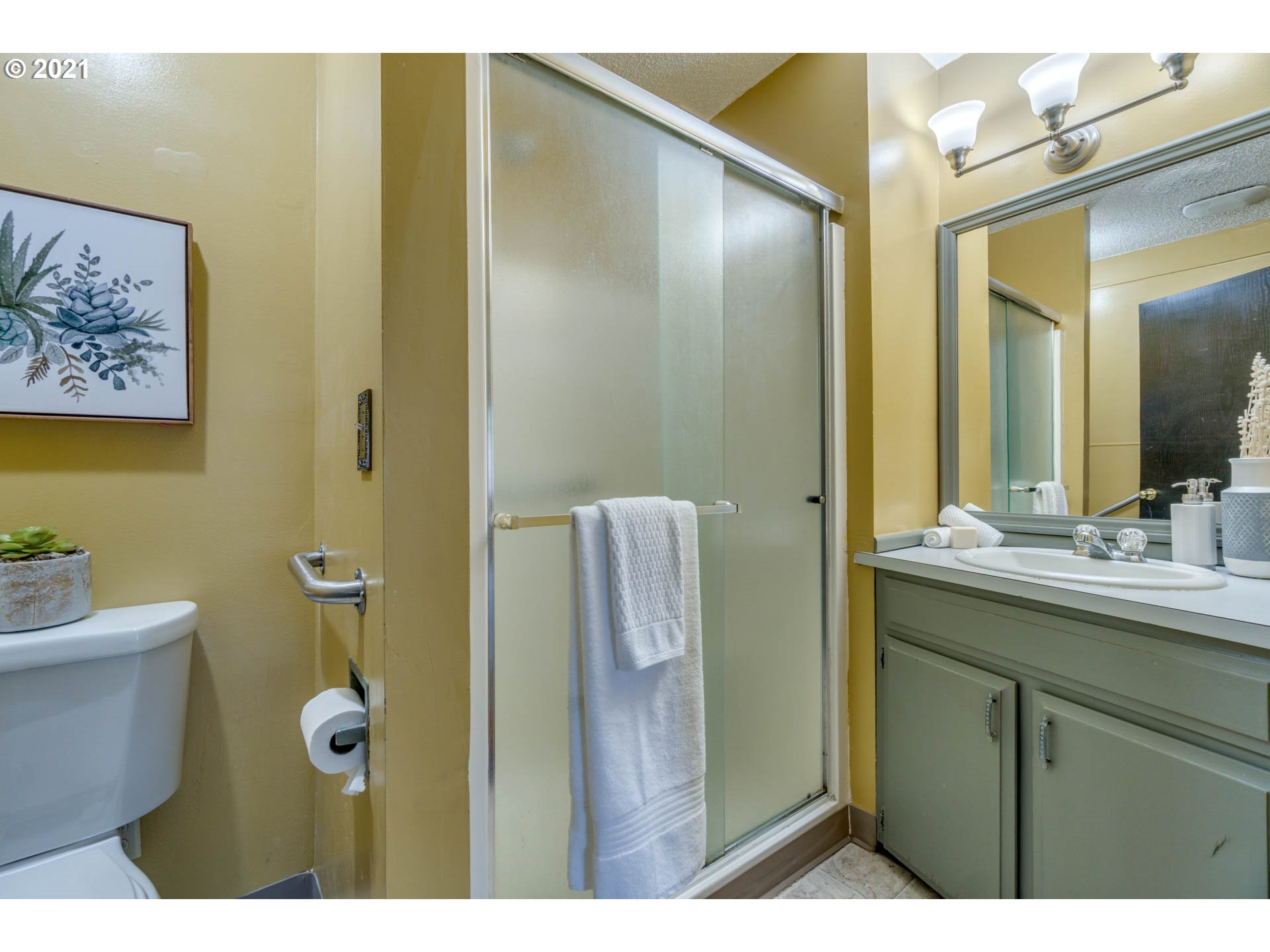 11555 Southwest Denney Road Beaverton, OR 97008 - Photo 20 of 28 a bathroom with a granite countertop sink a toilet and a mirror