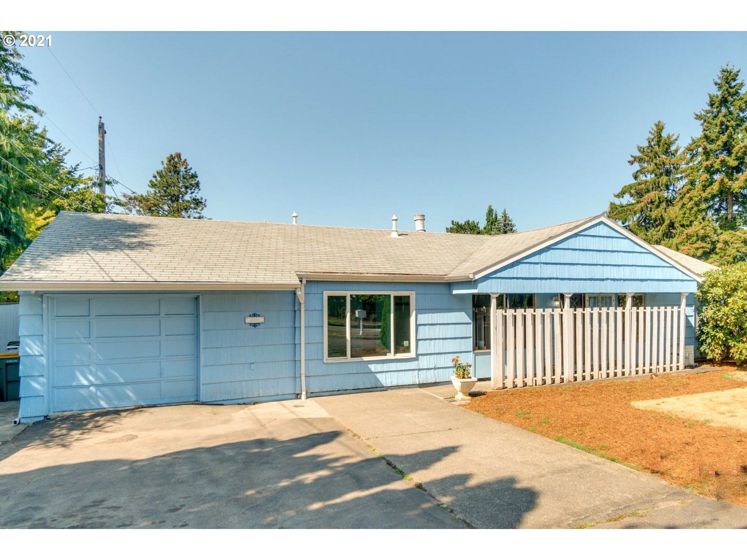 11555 Southwest Denney Road Beaverton, OR 97008 - Photo 2 of 28 a front view of a house with a yard