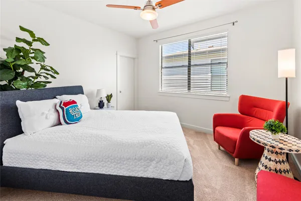 a bedroom with a bed and a couch