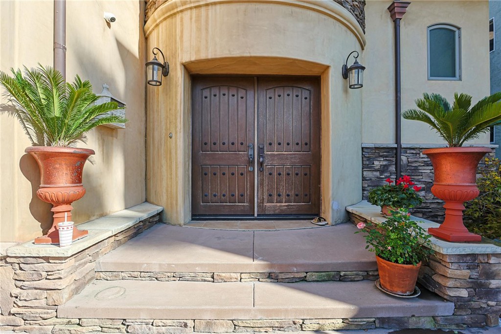 116 Termino Avenue Long Beach, CA 90803 - Photo 11 of 51 a potted plant sitting on the side of a building
