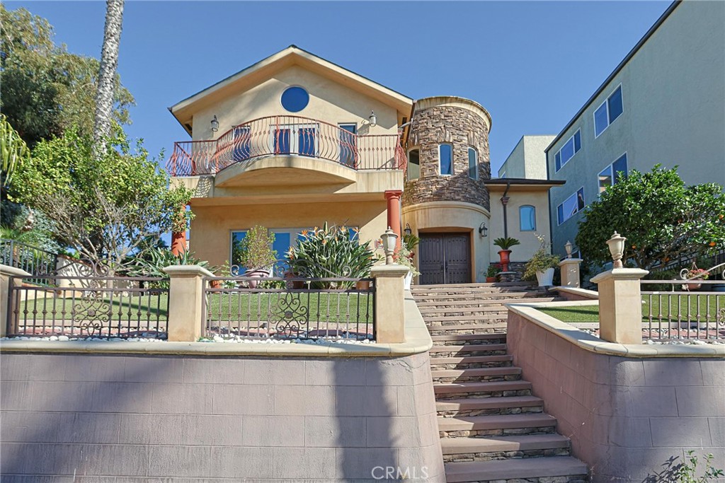 116 Termino Avenue Long Beach, CA 90803 - Photo 12 of 51 a front view of a house with a garden and plants