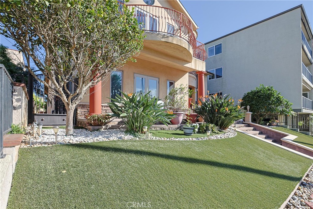 116 Termino Avenue Long Beach, CA 90803 - Photo 14 of 51 a front view of a house with a yard