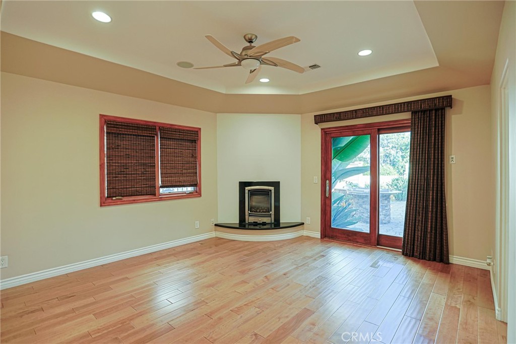 116 Termino Avenue Long Beach, CA 90803 - Photo 15 of 51 a view of a livingroom with a fireplace and wooden floor