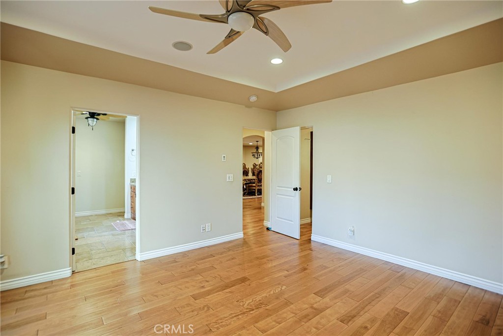 116 Termino Avenue Long Beach, CA 90803 - Photo 16 of 51 an empty room with a ceiling fan and entryway