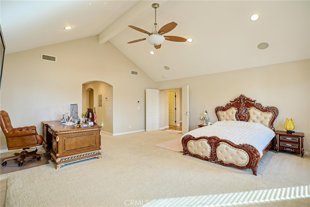 116 Termino Avenue Long Beach, CA 90803 - Photo 31 of 51 a bedroom with a bed and a chandelier