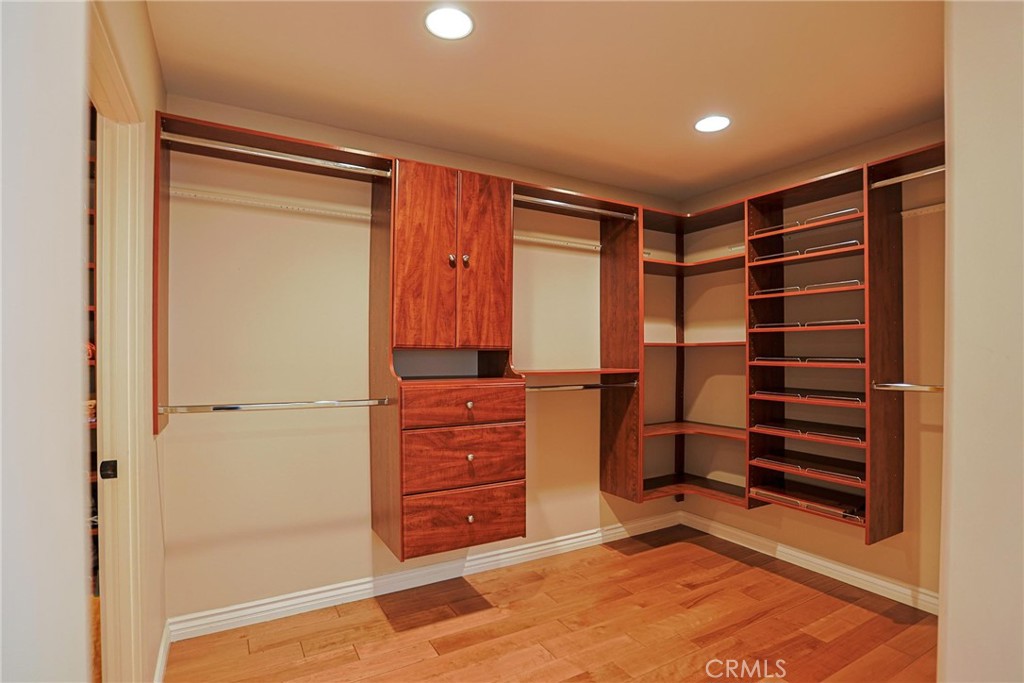 116 Termino Avenue Long Beach, CA 90803 - Photo 33 of 51 a view of walk in closet with clothes and shoes