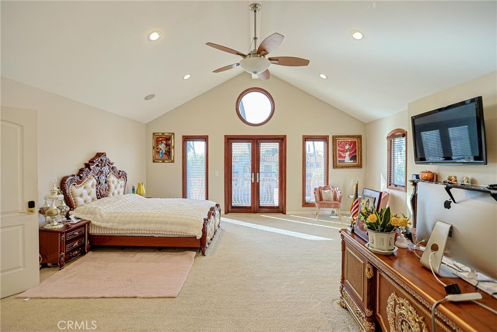 116 Termino Avenue Long Beach, CA 90803 - Photo 36 of 51 a bedroom with a bed and a flat tv screen on the dresser