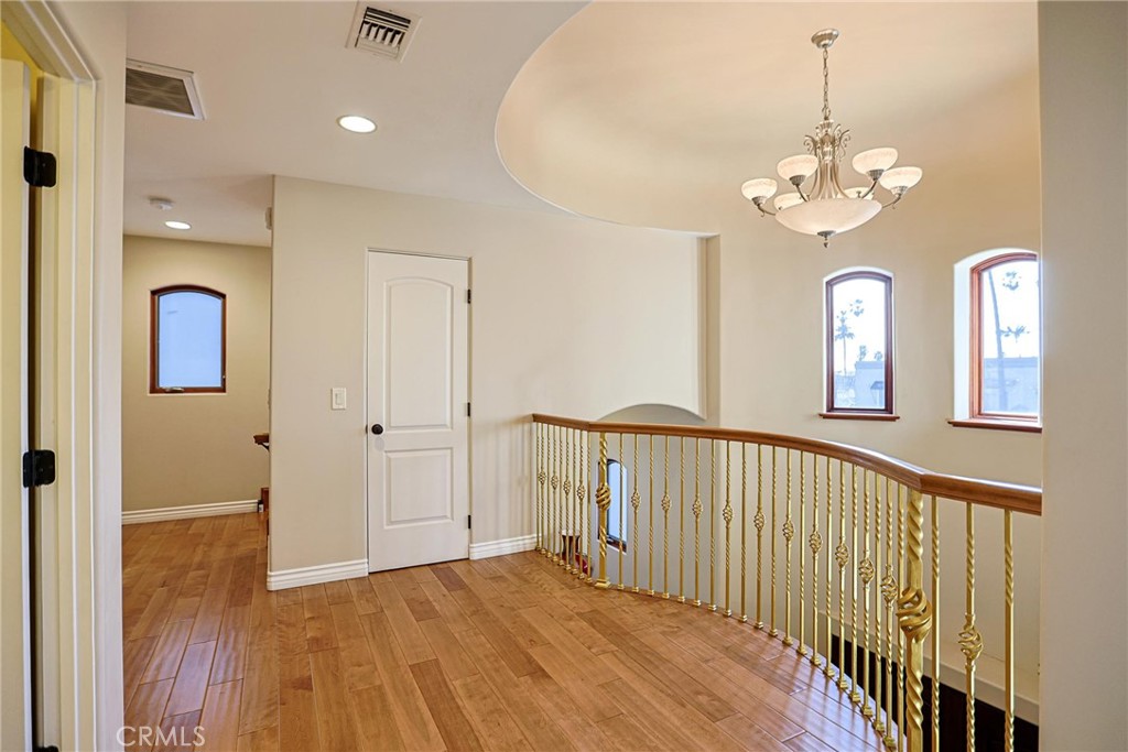 116 Termino Avenue Long Beach, CA 90803 - Photo 37 of 51 a view of a hallway with wooden floor