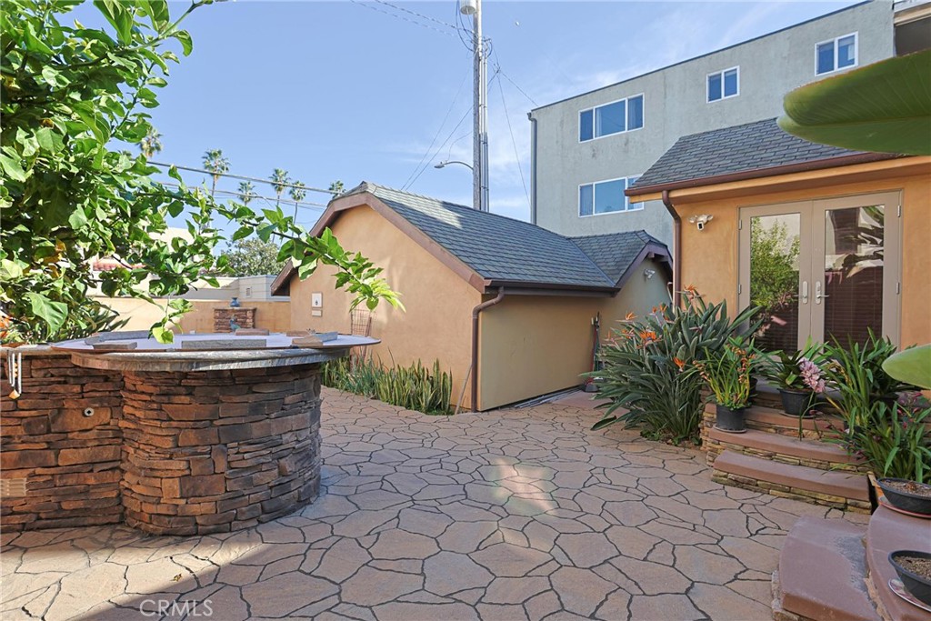 116 Termino Avenue Long Beach, CA 90803 - Photo 47 of 51 a view of a wooden door with a bench in patio