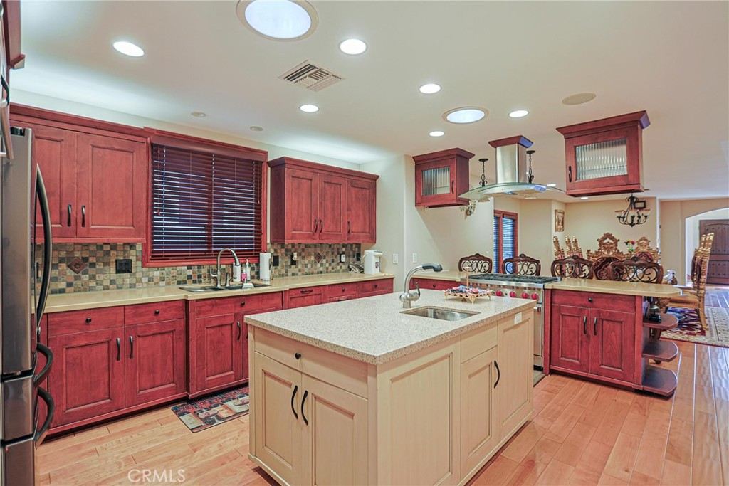 116 Termino Avenue Long Beach, CA 90803 - Photo 8 of 51 a kitchen with a sink stove and cabinets