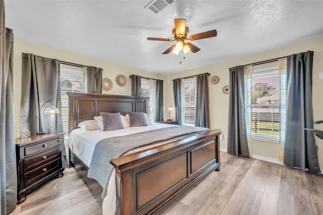 a bed room with a bed and a chandelier