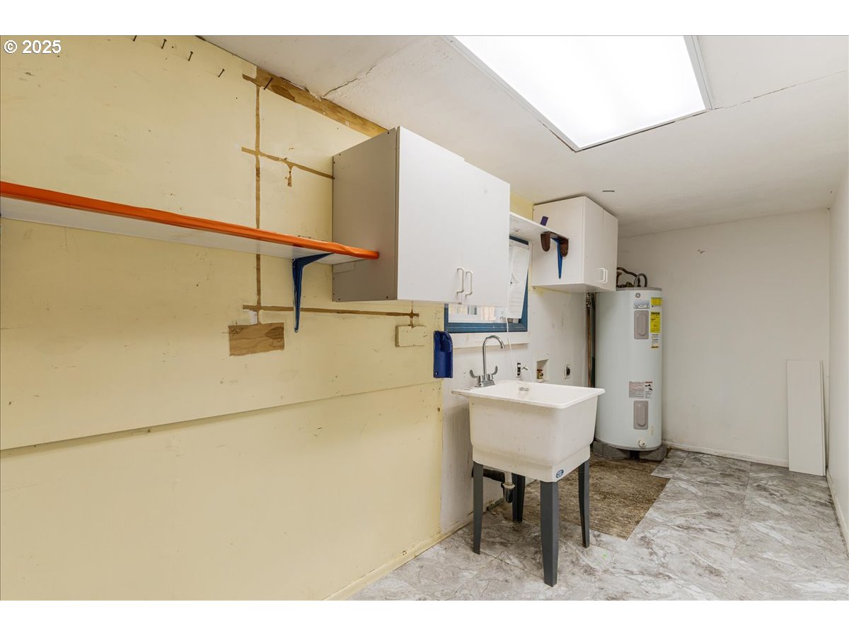 719 South Chehalem Street Newberg, OR 97132 - Photo 17 of 27 a kitchen with a sink cabinets and appliances