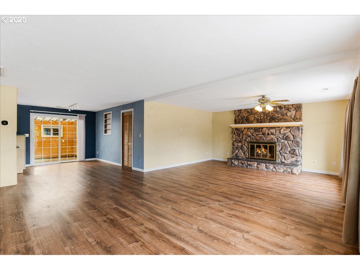 719 South Chehalem Street Newberg, OR 97132 - Photo 6 of 27 a view of empty room with wooden floor