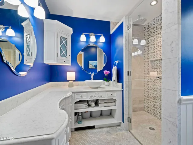 a bathroom with a tub and shower