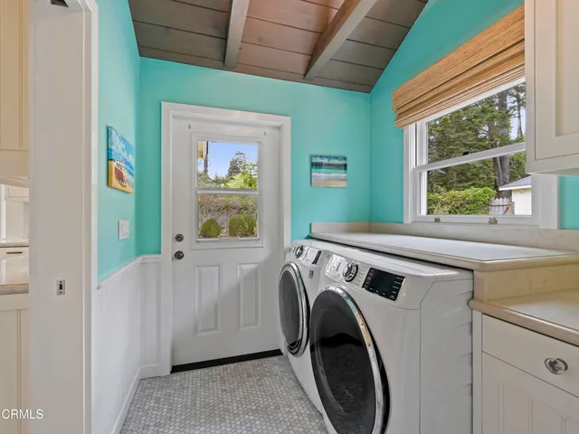 a view of a kitchen with washer and dryer