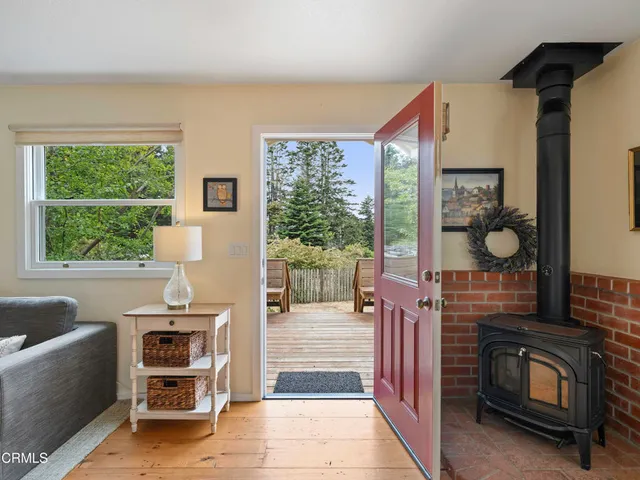 a bedroom with furniture and a fireplace