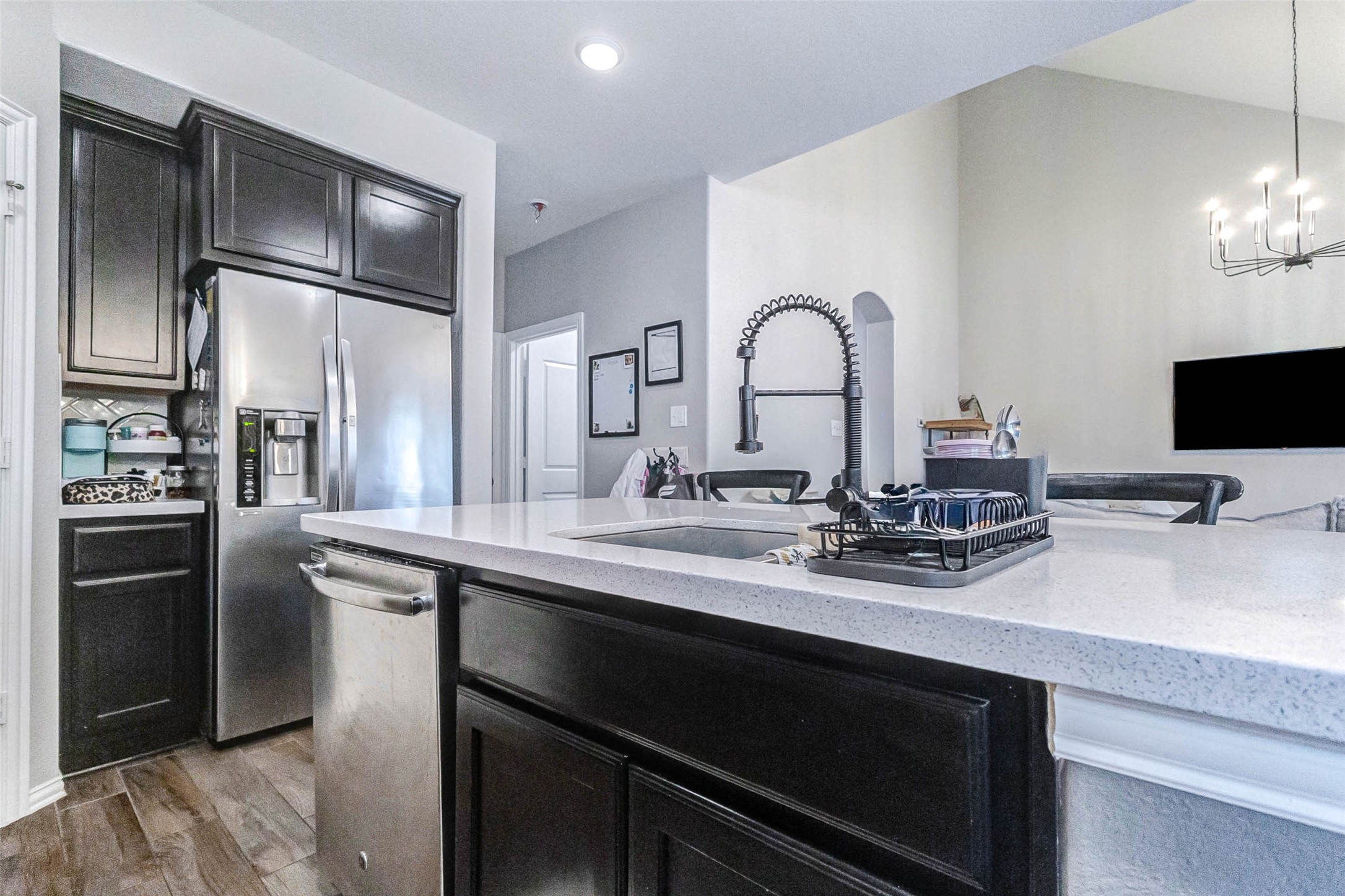 3210 Montclair Orchard Trace Spring, TX 77386 - Photo 16 of 38 a kitchen with a sink stainless steel appliances and cabinets