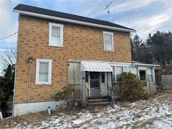 a front view of a house with yard