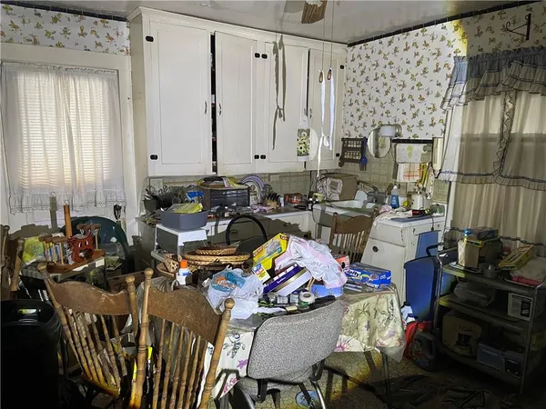 a view of a workspace with furniture