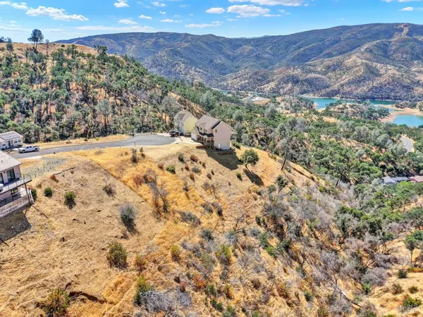 a view of a terrace with a table and chairs