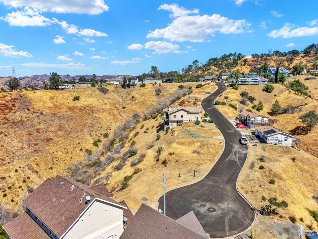 a view of a houses with a road