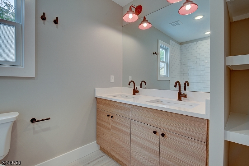 81 Mission Street, Unit 1 Montclair, NJ 07042 - Photo 9 of 19 a bathroom with a sink and a mirror