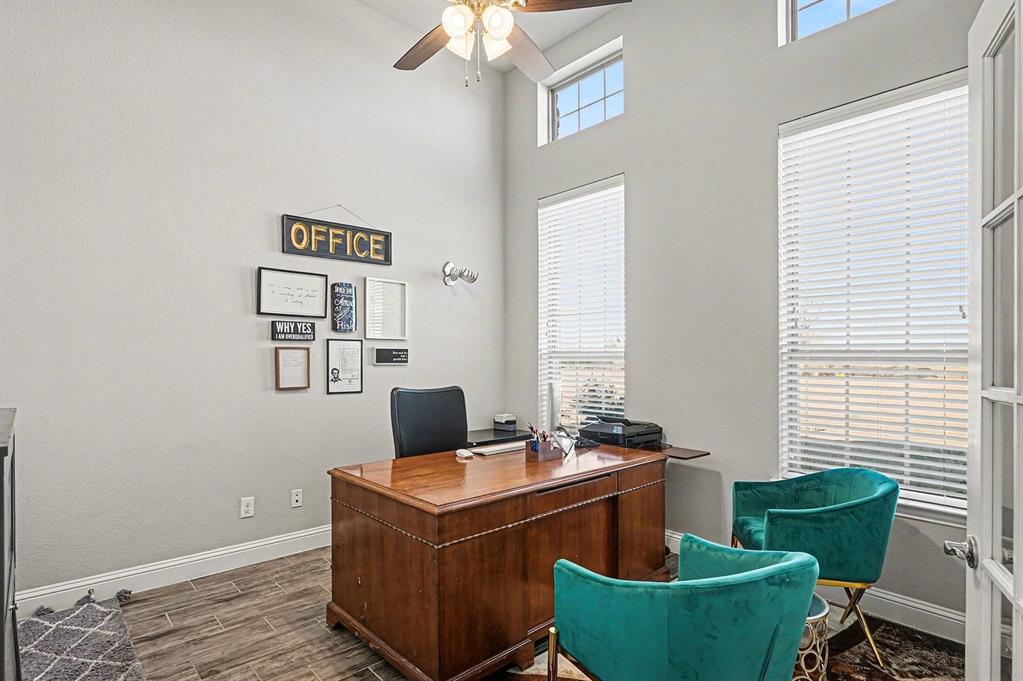 415 Silver Spur Trail Rockwall, TX 75032 - Photo 15 of 40 a living room with furniture and a potted plant